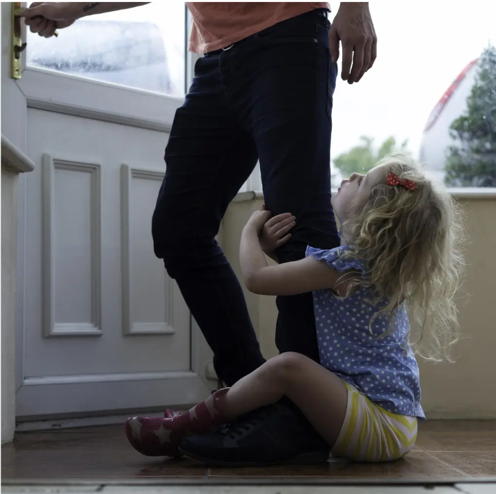 daaghter_clings_to_dad_leg-_lacie_bowden_law.png