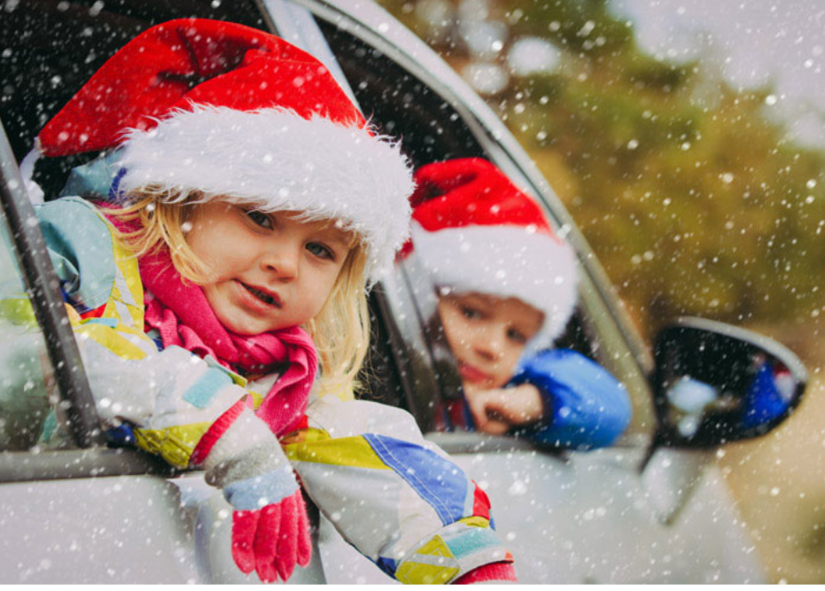 girl_and_boy_with_santa_hats-_lacie_bowden_law.png
