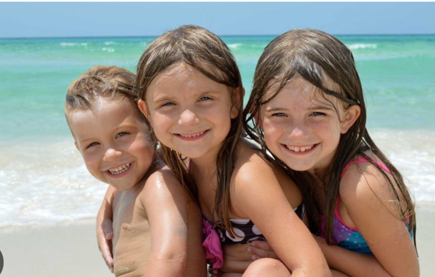 3_kids_on_pensacola_beach-_lacie_bowden_law.png