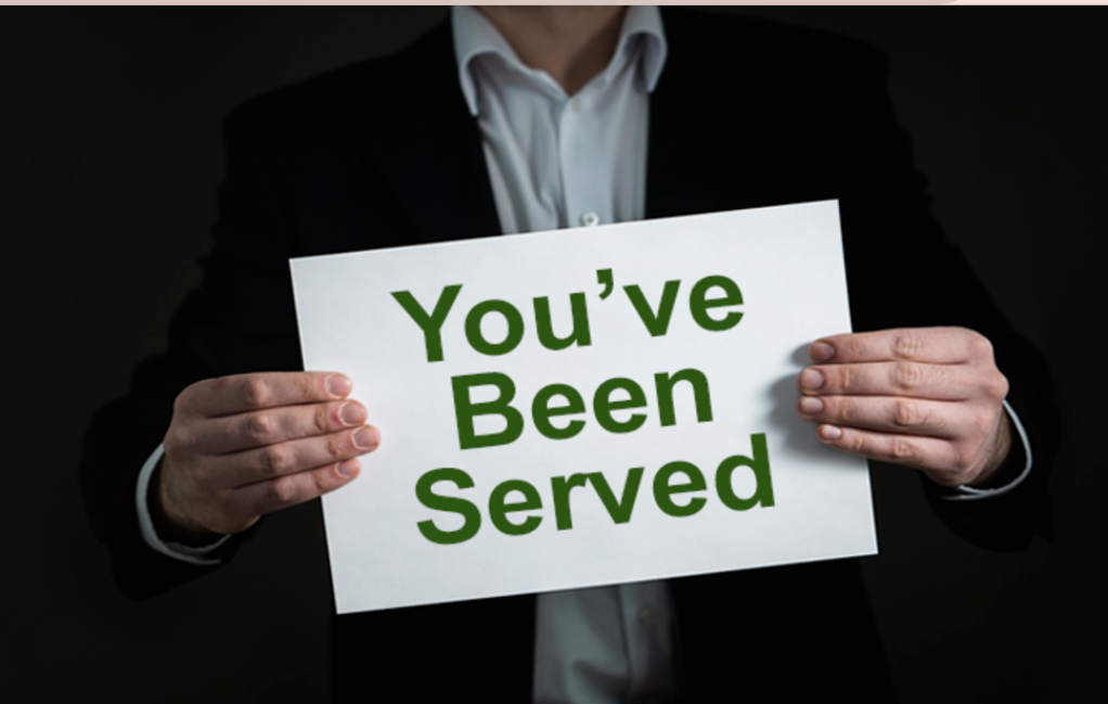 man_with_white_sign-divorce_attorney_gulf_breeze-_lacie_bowden_law.png