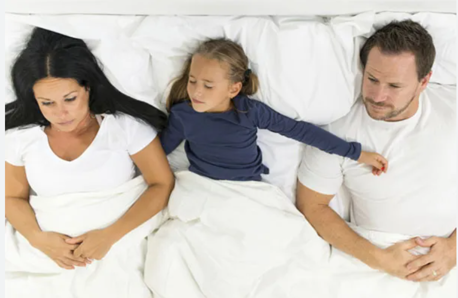 unhappy_parents_in_bed_with_daughter-lacie_bowden_law.png unhappy_parents_in_bed_with_daughter-lacie_bowden_law.png